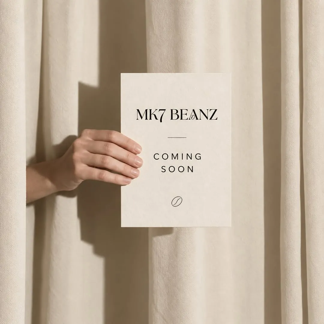 MK7 Beanz coming-soon card held through a curtain
